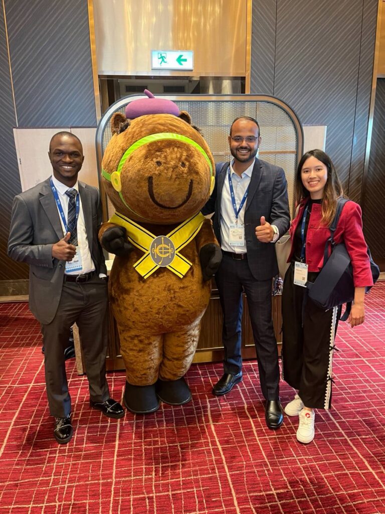 With fellow delegates and the Hong Kong Jockey Club mascot