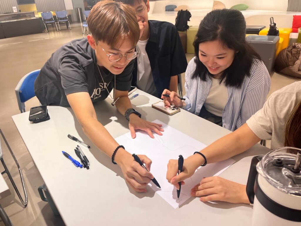 A team sketching their solution